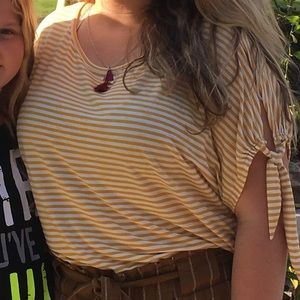 a white and yellow striped shirt